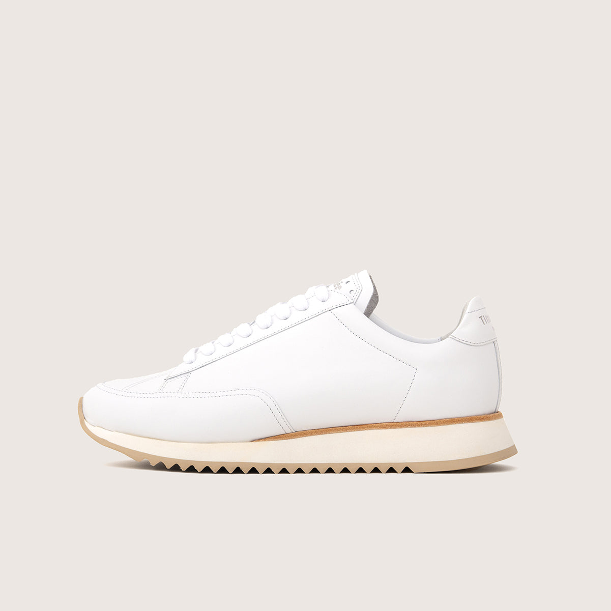 clean white handcrafted sneaker cabourg by french brand timothee paris profile view